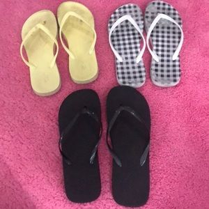 yellow, black, and checkerboard flip flops